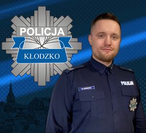 zdjęcie policjanta , a w tle kłodzkiego - gwiazda policyjna